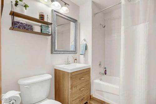 a bathroom with a toilet and a sink and a tub at Ski-In Ski-Out Zephyr 1 Bedroom Condo 2204 in Winter Park