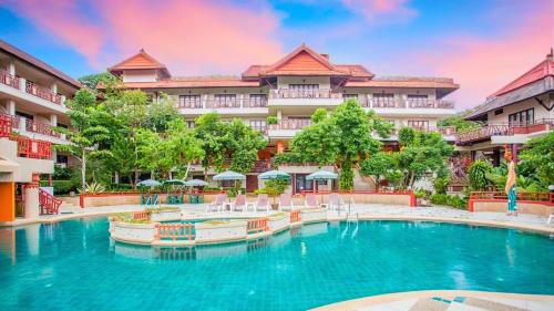 a swimming pool in front of a hotel at Anyavee Aonang Bay Resort อัญญาวี อ่าวนางเบย์ รีสอร์ท in Ao Nang Beach