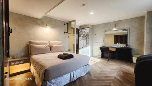 Postel nebo postele na pokoji v ubytování 艾睏設計行旅 Sleepie Design Hotel