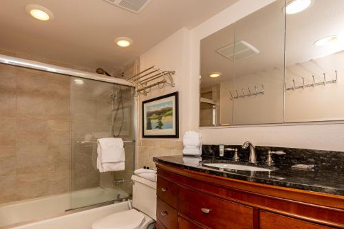 a bathroom with a sink and a toilet and a shower at Saints John 2500 by Summit County Mountain Retreats in Snake River Health Services Incorporated Heliport