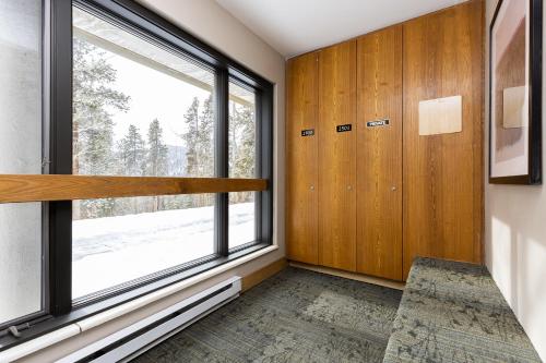 a room with a large window and a desk at Saints John 2500 by Summit County Mountain Retreats in Snake River Health Services Incorporated Heliport