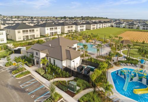an aerial view of a resort with a pool and playground at Lovely apartments 18 Minutes away from Disney! in Kissimmee