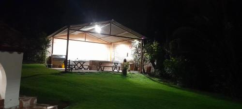 a pavilion with a light on it at night at Reserva de Santa Ines Valle de Tibasosa in Tibasosa