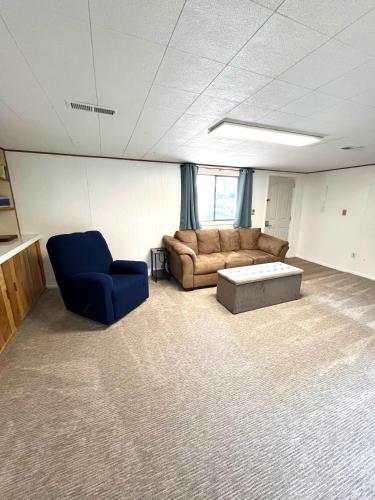 a living room with a couch and a coffee table at Park Home- Parkside Haven for Families & Pets in Pocatello
