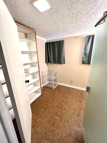 an empty room with a closet and a door at Park Home- Parkside Haven for Families & Pets in Pocatello