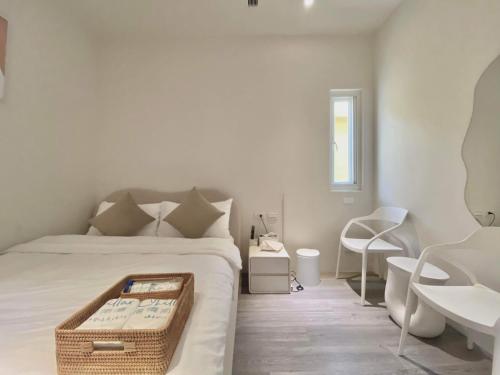 Postel nebo postele na pokoji v ubytování 慢慢南灣民宿 chillaxNanwan B&B