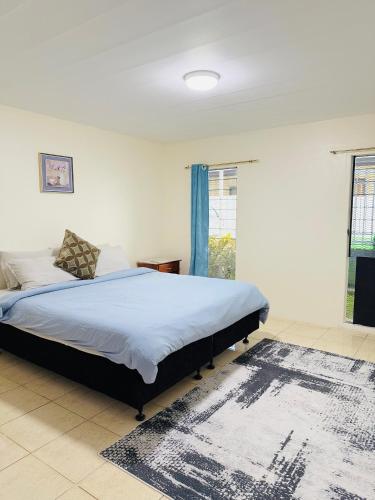 Llit o llits en una habitació de Bountiful Estates