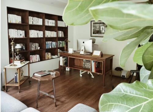 a room with a desk with a computer in it at Bora's cozy house in Samgong
