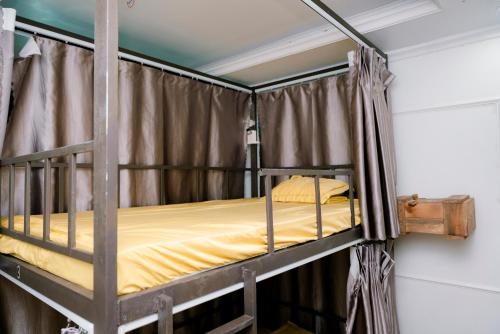 Ένα ή περισσότερα κρεβάτια σε δωμάτιο στο The Hive Hostel - Tam Coc