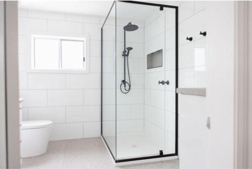 a bathroom with a glass shower with a toilet at Yarrawonga walk everywhere in Yarrawonga