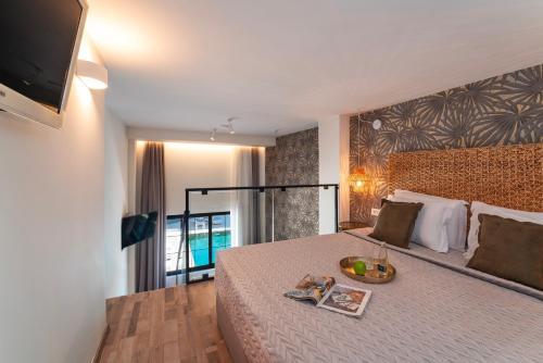 Кровать или кровати в номере Naillac Boutique Hotel