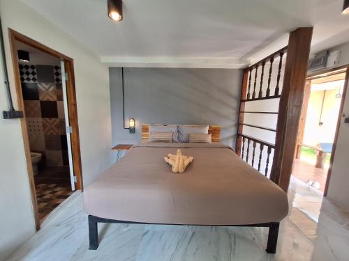 a bedroom with a large bed with a starfish on it at The Seasons At Pai in Pai