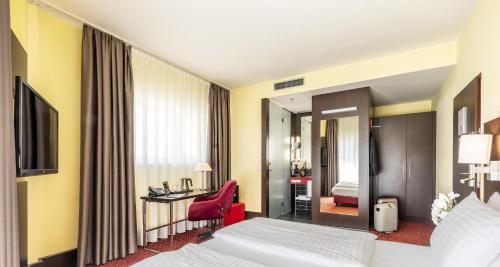 Katil atau katil-katil dalam bilik di Best Western Plus Amedia Art Salzburg