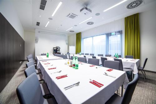 a conference room with white tables and chairs at Best Western Hotel Tulln in Tulln