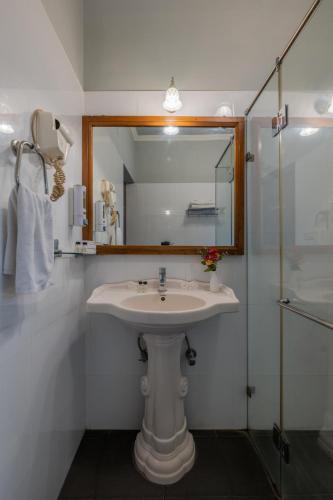 a bathroom with a sink and a mirror and a shower at Rajasthan Palace - A Heritage Boutique Hotel in Jaipur in Jaipur