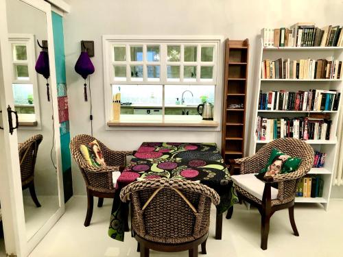 a room with a table and chairs and a window at Muzeum design Apartment at downtown in Budapest