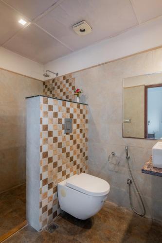 a bathroom with a toilet and a sink at Rajasthan Palace - A Heritage Boutique Hotel in Jaipur in Jaipur