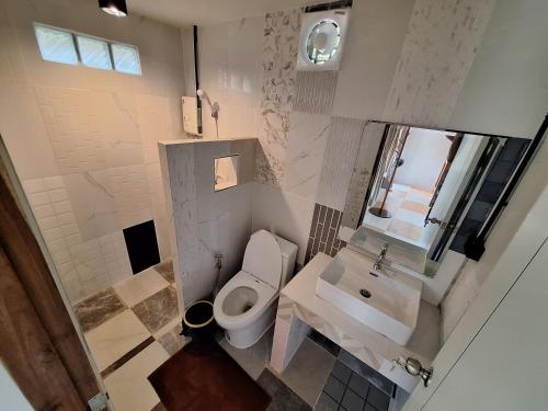 an overhead view of a bathroom with a toilet and sink at The Seasons At Pai in Pai