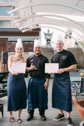 a group of three people wearing chefs hats at Villa Kayu Raja in Seminyak