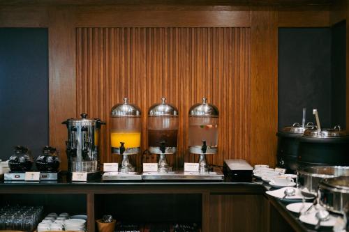 a kitchen with a counter with aasteryasteryasteryasteryasteryasteryasteryasteryastery at Villa Kayu Raja in Seminyak