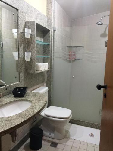 a bathroom with a toilet and a sink and a shower at Marulhos Resort Muro Alto Studio in Porto De Galinhas