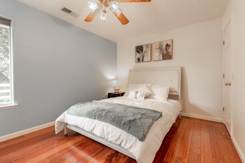 a bedroom with a bed and a ceiling fan at Yosemite and Bass lake I Hot tub I Game room I Sleeps 13 in Oakhurst