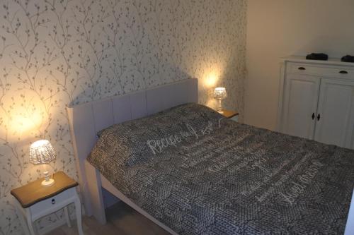 En eller flere senge i et værelse på Bed en Breakfast de Houtwiel