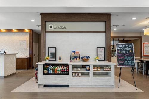 a store with a counter with food on it at Hilton Garden Inn Martinsburg in Martinsburg