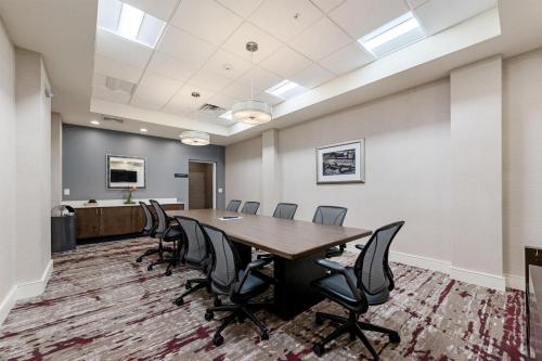 a conference room with a long table and chairs at Hilton Garden Inn Martinsburg in Martinsburg