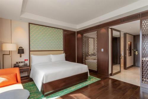 Ένα ή περισσότερα κρεβάτια σε δωμάτιο στο Hilton Da Nang