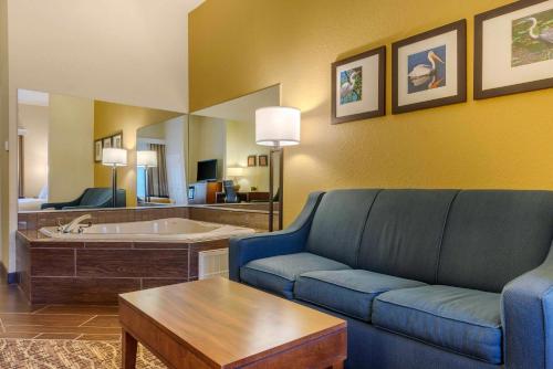 a living room with a couch and a table at Comfort Suites Lady Lake - The Villages in The Villages