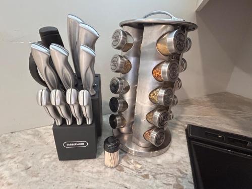 a bunch of utensils in a knife block on a counter at The Highland Oasis in Ephrata