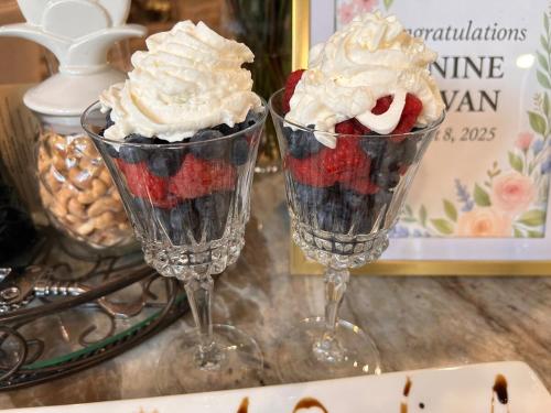 two glasses filled with ice cream and strawberries and whipped cream at The Highland Oasis in Ephrata