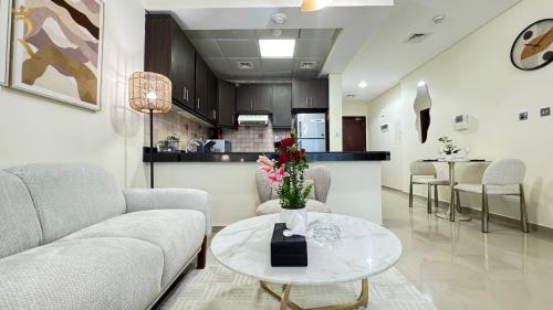 a living room with a couch and a table at 1BR Al Reem Island - Chic & Serene Luxe Retreat in Abu Dhabi