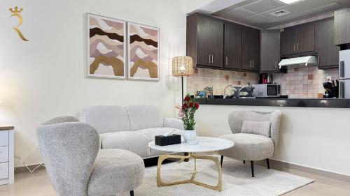 a living room with a couch and chairs and a table at 1BR Al Reem Island - Chic & Serene Luxe Retreat in Abu Dhabi
