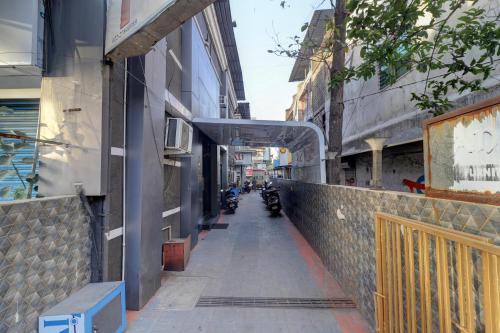 an empty street with motorcycles parked on the side of a building at Hotel Platinum Inn in Navi Mumbai