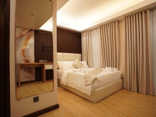 Chateau de Maisons Suitesにあるベッド