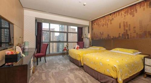 Postel nebo postele na pokoji v ubytování Shijiazhuang Ximeijin Continental Hotel