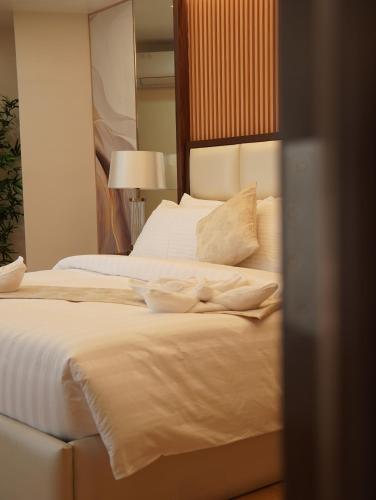 Chateau de Maisons Suitesにあるベッド