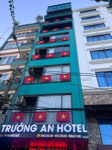 a building with a sign on the side of it at Trường An Hotel in Cao Bằng