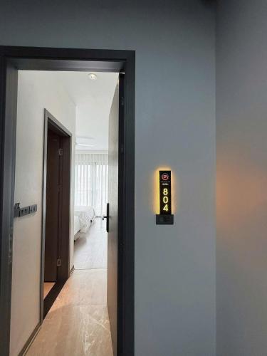 a door with a clock on the side of a room at Trường An Hotel in Cao Bằng