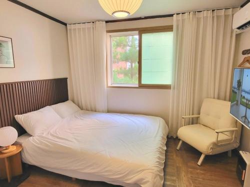 Katil atau katil-katil dalam bilik di Dolce house korea