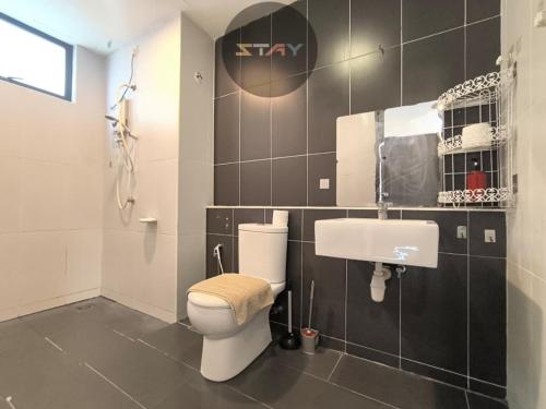 a bathroom with a toilet and a sink at The Garden 2BR 4Pax Cozy Stylish Netflix BySTAY in Skudai