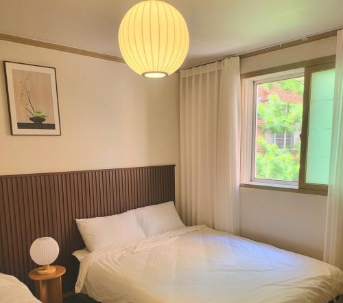 Katil atau katil-katil dalam bilik di Dolce house korea