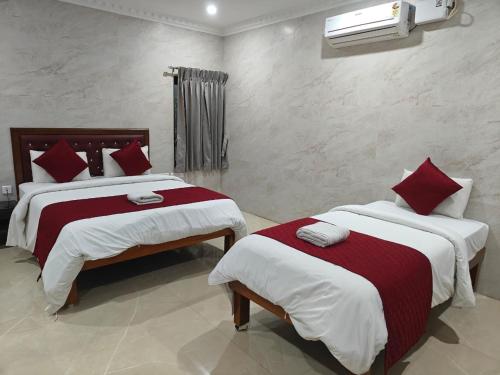 Ένα ή περισσότερα κρεβάτια σε δωμάτιο στο Hotel Grand Palace
