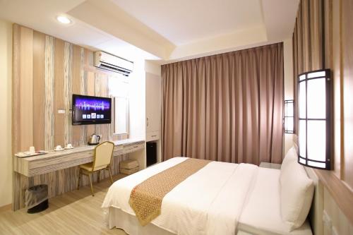 Postel nebo postele na pokoji v ubytování Chengdian Hotel