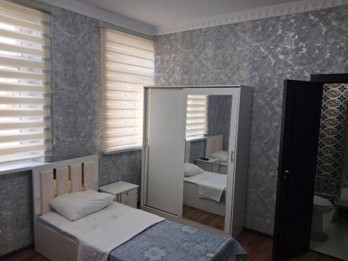 Katil atau katil-katil dalam bilik di Xojai Jahon HOTEL in Gijduvon