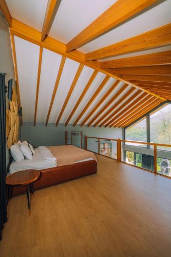 a bedroom with a bed and a table in a room at Monk Living Space in Kocaeli