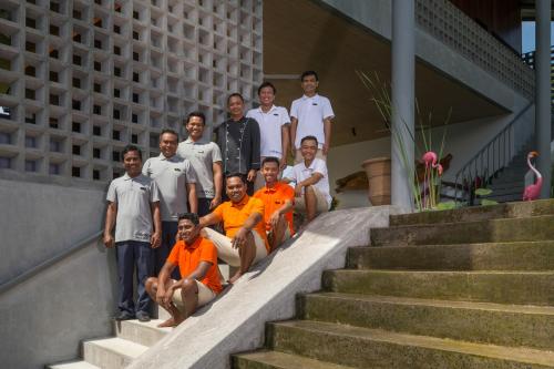 a group of men posing for a picture on the stairs at caSabama by Nakula in Keramas