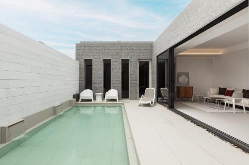 a swimming pool on the roof of a building at Uniisland The Spaville in Incheon